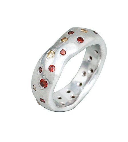 Organic shaped wedding ring with scattered mixed colour diamonds bead set randomly around the whole ring.